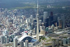 Breathtaking shot of the CN Tower and Skydome in downtown Toronto, while approaching to overfly the Toronto City Centre airport (CYTZ). May 2005.