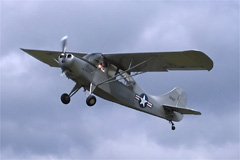 I snapped this photo of TJ Lilliman's L-16 (the military version of the Aeronca Champ) departing the 2006 Ultralight Pilots Association of Canada convention at Lubitz field.