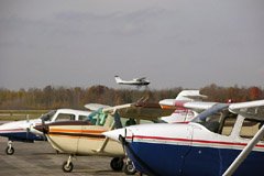 A busy day at the Waterloo International Airport (CYKF). The planes in the foreground are part of the Waterloo-Wellington Flight Centre's fleet of Cessna and Piper aircraft.