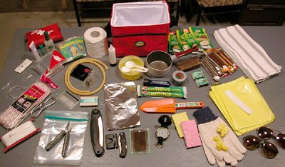 The entire contents of my survival kit except the manual, manifest, and grease pencil. Click for a closer look.