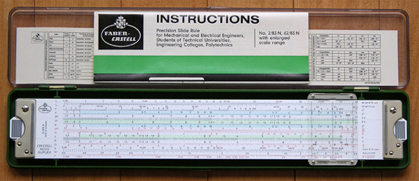 Faber-Castell 2/83N slide rule, case, manual, and reference card.