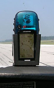 Garmin eTrex Legend GPS in its mount, on the glareshield of a Cessna 172N.