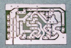 The printed circuit board after etching. The traces aren't as straight as they are in Figure 2 above because they were transferred to the board by hand, using an etch-resist pen.