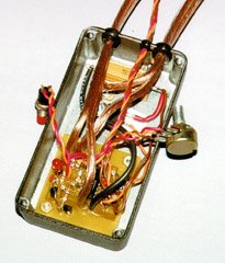 Off-board components are mounted to the case and attached to the board with appropriate gauge wires.