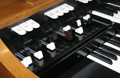 The harmonic drawbars on a Hammond M-111 spinet organ.