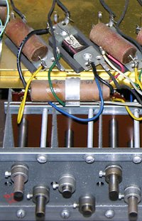 Three tone generator filters from my 1962 Hammond M-111 with wax-paper capacitors. Click image for details.