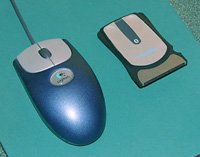 The MoGo Mouse and an early Logitech corded optical mouse.