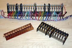 Key contact blocks from the Yamaha keyboard in various states of disassembly and cleanup.