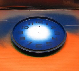 Clock case and existing dial after spray painting the inside edge.