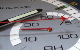 Close up view of the hour hand, second hand, and hygrometer hand.