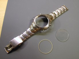 Watch case, crystal, and compression ring.