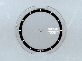 The original LCD overlay with painted-on inner chapter ring.