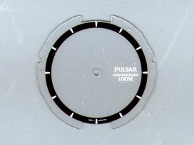 The original LCD overlay with painted-on inner chapter ring.