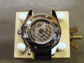 The transparent case back reveals the Seiko NH35A movement.