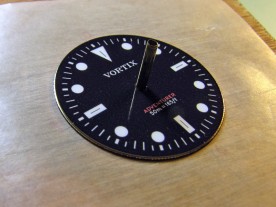The artwork in place on the dial, aligned with the marks on the block.