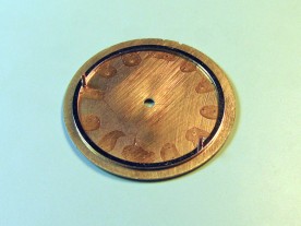 The Alpha's brass dial spacing ring was originally 0.57mm thick.