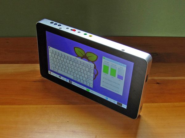 The completed tablet showing the on-screen keyboard and system monitor utility.