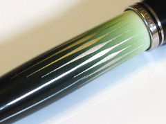 The defining feature of the Polar Lights pen is its lacquered barrel, inlaid with platinum. I have yet to see a photo that does it justice.