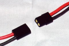 An AstroFlight Zero-Loss connector set, lined up for connection. Notice that one edge is round, and one is square.