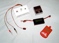 Field box electronic equipment, clockwise from top left: home made peak charger, home made expanded scale voltmeter (ESV), GloBee tachometer, and Astroflight Whattmeter.