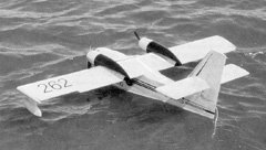 Robert Pike's Canadair CL-215 water bomber uses a pair of Astro 05G geared motors, 10x8 props, and 20 cells. 10x7 props and 21 cells (three 7-cell packs) would also work well. Wing span is 76 inches, area is 800 sq.in, and wing loading is 23 oz/sq.ft.