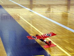 Taxiing onto the "runway" in the college gymnasium with a GWS Pico Stick.