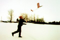 Boots, snow pants, a warm jacket, gloves, a toque, and dark sunglasses are essential winter flying apparel.