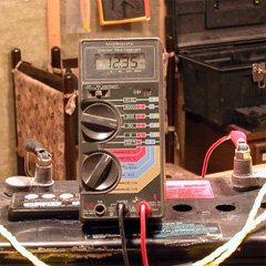 The 12.35V reading on the digital voltmeter indicates a 67% charge, agreeing with the hygrometer. Be sure to measure at room temperature, at least 24 hours after charging. 