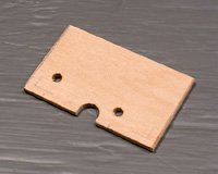 The wing hold-down plate is made from 1/8" birch plywood (not lite-ply). The holes and notch are for the receiver antenna and access to the servo screws.