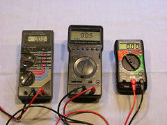 A collection of digital multimeters. The one on left is about 15 years old, while the one on the right is brand new, does all the same things, at a quarter of the cost.