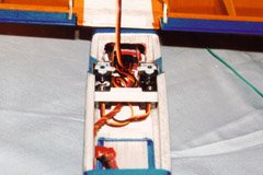 A view into the under-wing area, showing the Hitec HS55 rudder and elevator servos, and the Feather receiver behind them.