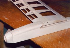 Completed forward fuselage and canopy, with one wing half in place for reference.