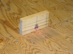 I used a laser to mark a straight line down the centre of the workbench.