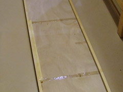 Glue applied to the fuselage sides with a disposable epoxy brush.