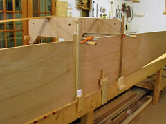 Slightly bowed 1x2 lumber was clamped with blocks at the bottom, and 2' clamps at the top.