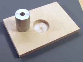 25mm aluminum bushing and wood block with 32mm hole.