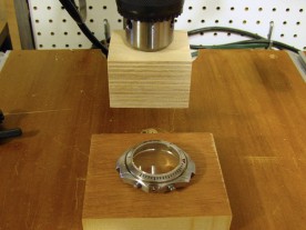 A drill press and some wooden blocks make a suitable press for flat crystals.