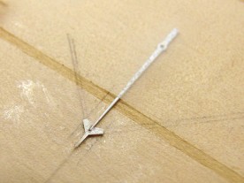 The tip was glued to the second hand with epoxy.