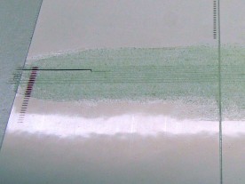 Vinyl label material cut into strips and coated with lume.