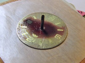 Orient dial with a very thin even coat of T-88 epoxy.