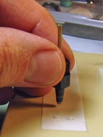 Transferring the indices to a piece of label backing.