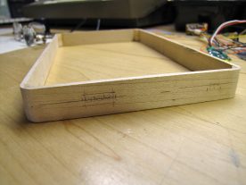 I made rectangular holes by starting with a series of round holes.