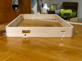 The rectangular holes were finished using a small chisel and files.